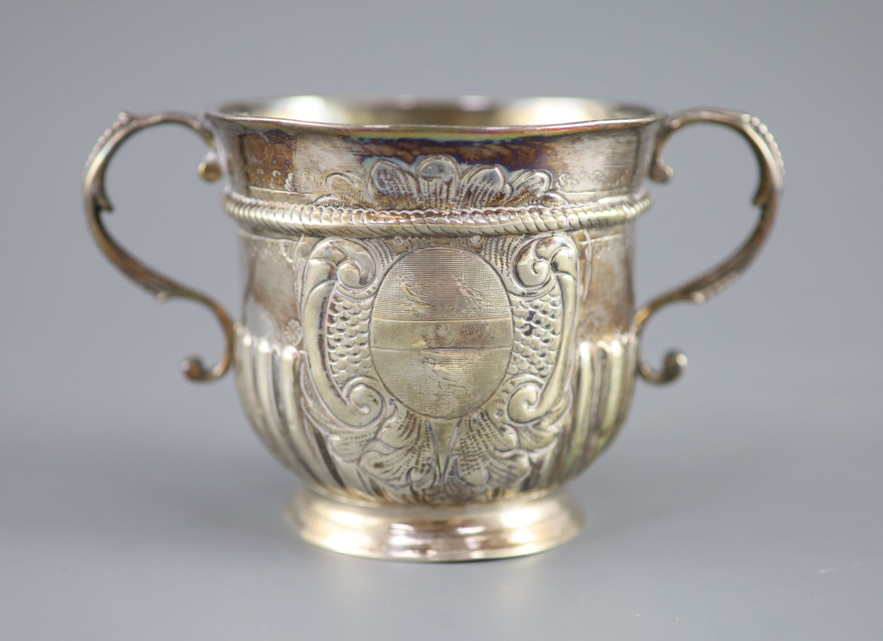 A Queen Anne demi-spiral fluted silver porringer